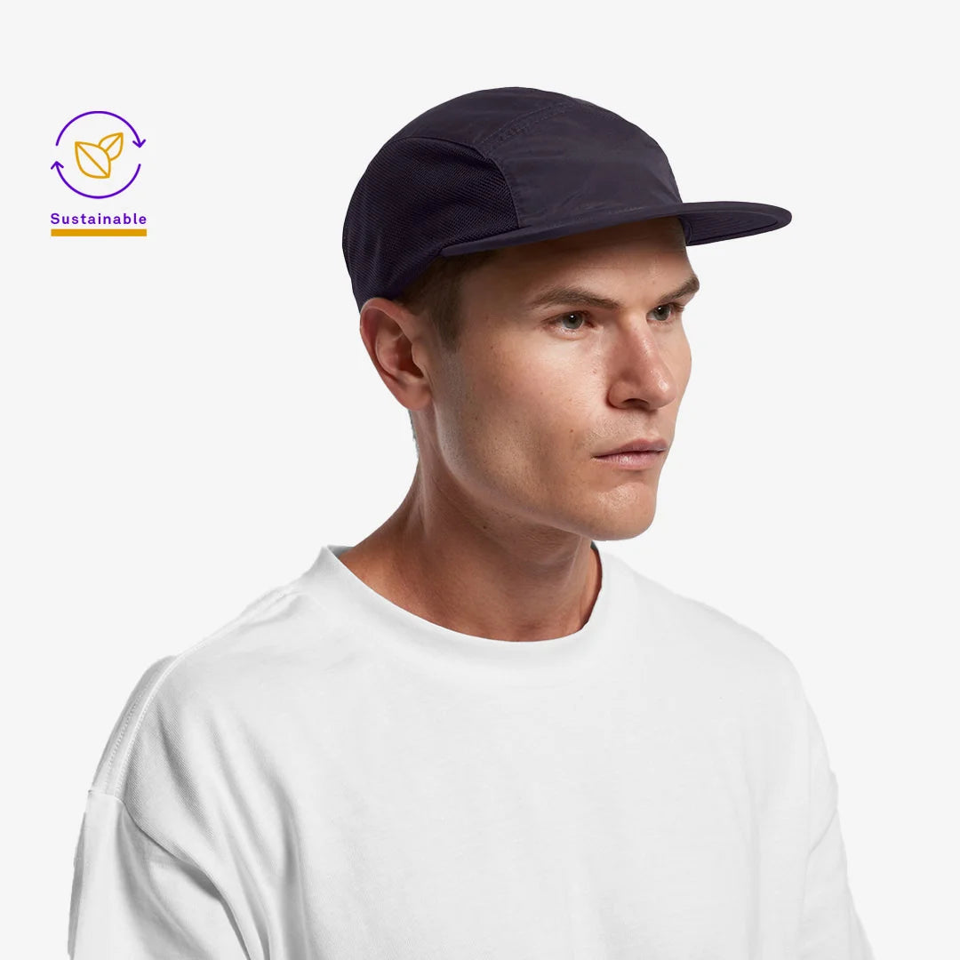 Man wearing AS Colour Finn Active Cap in Navy Side - 1180