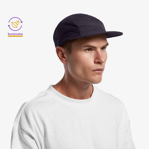Man wearing AS Colour Finn Active Cap in Navy Side - 1180