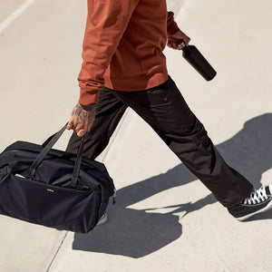 Lifestyle Photo of Bellroy Company Branded Lite Duffel in Black - BR1007