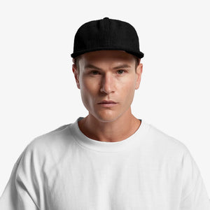 Man wearing AS Colour Class Cord Cap - 1152
