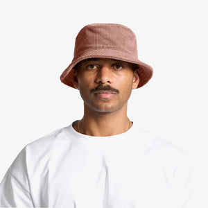 Man wearing AS Colour Cord Bucket Hat in Hazy Pink - 1176