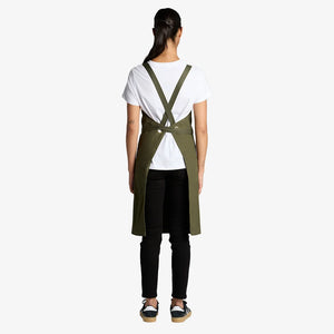 Woman wearing AS Colour Carrie Apron Back in Army - 1082