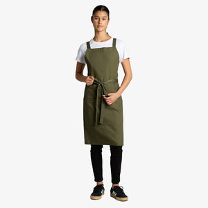 Woman wearing AS Colour Carrie Apron Front in Army - 1082
