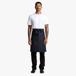 Man wearing AS Colour Carrie Half Apron Front in Navy - 1083