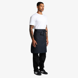 Man wearing AS Colour Carrie Half Apron Side in Navy - 1083