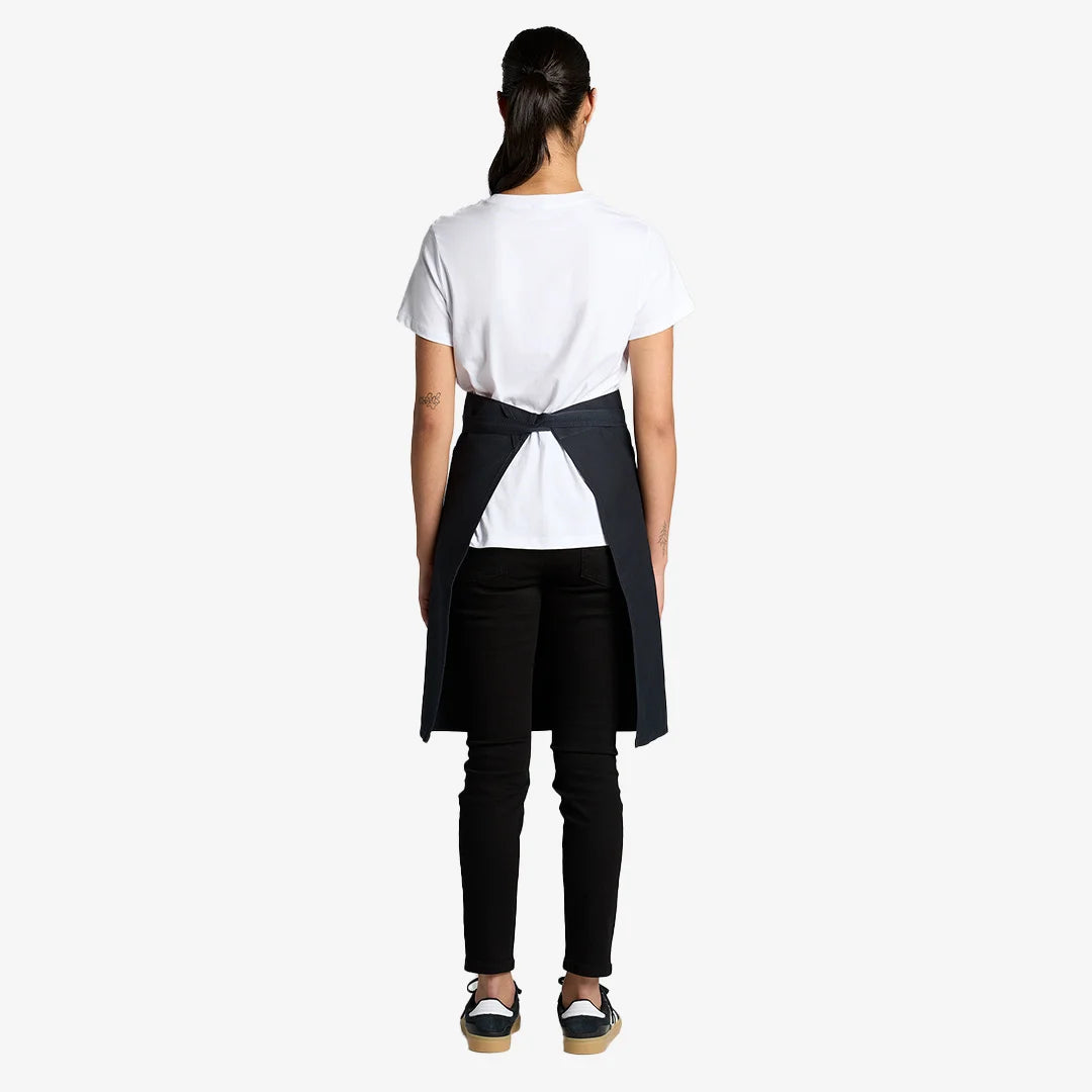 Woman wearing AS Colour Carrie Half Apron Back in Navy - 1083