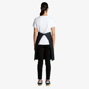 Woman wearing AS Colour Carrie Half Apron Back in Navy - 1083