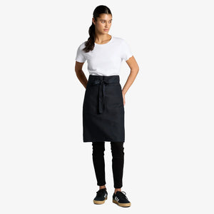 Woman wearing AS Colour Carrie Half Apron Front in Navy - 1083