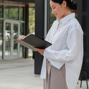 Woman checking notes on Orbitkey Compendium A5 Active in Black