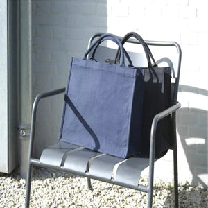 Darani Page Recycled Tote Black and Navy in a chair - DA1013