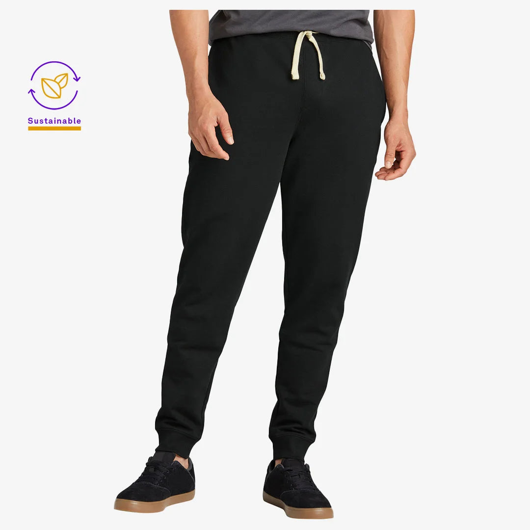 Man wearing District Men's Recycled Re-Fleece Jogger Pants in Black - DT8107