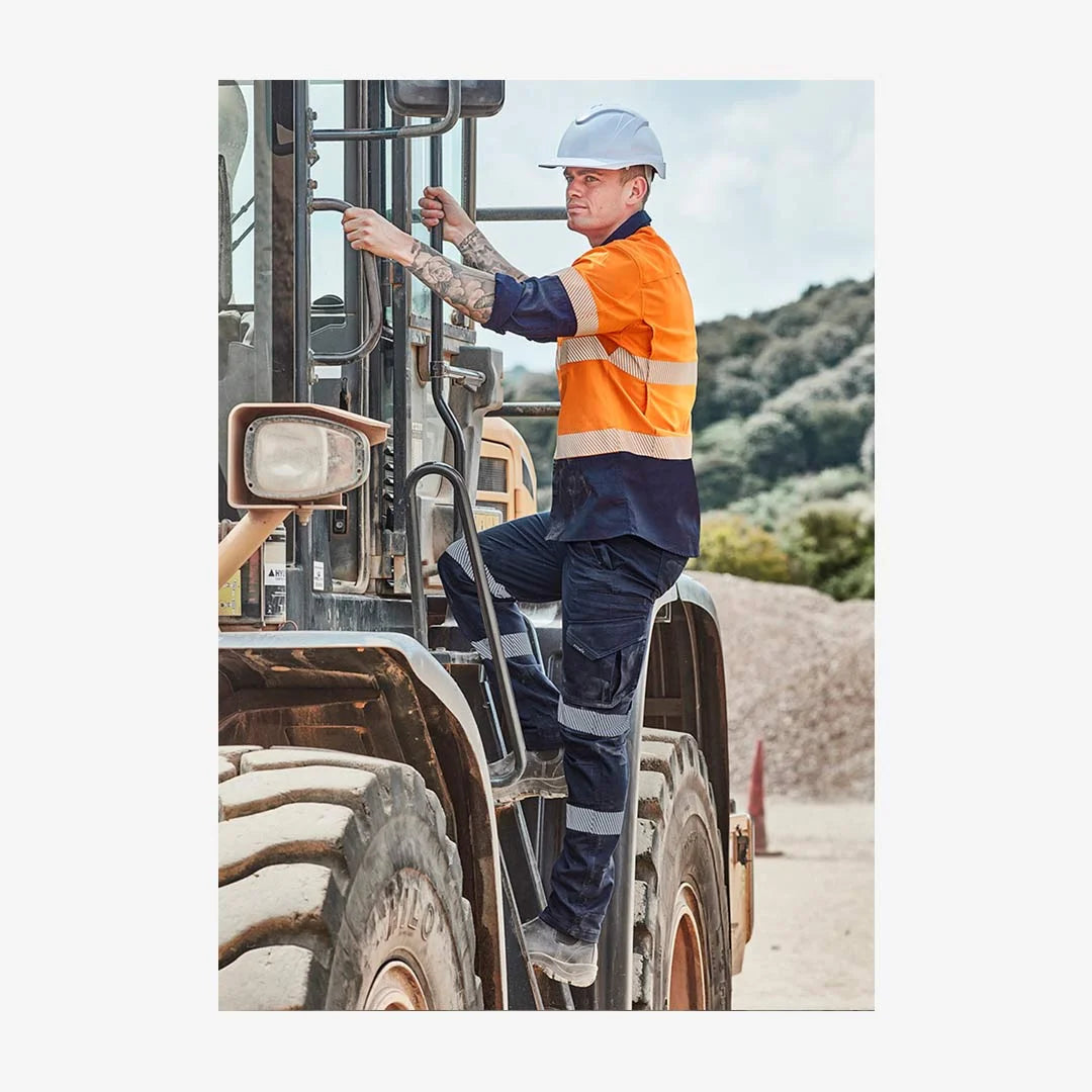 Man wearing Syzmik Men's Rugged Cooling Stretch Taped Pant in Navy - ZP924 | Mercha 
