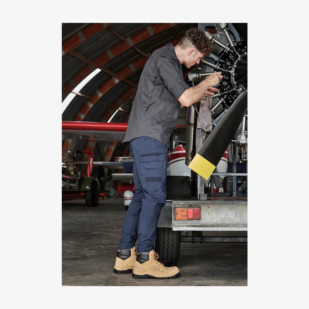 Man wearing Syzmik Men’s Streetworx Heritage Cuffed Pant ZP420 - Mercha