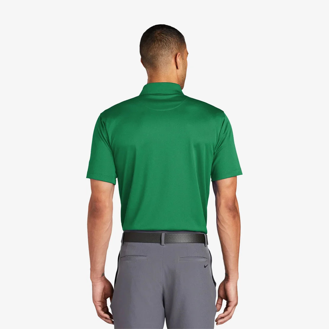 Man wearing Nike Tech Basic Dri-FIT Polo Back in Lucky Green - 203690