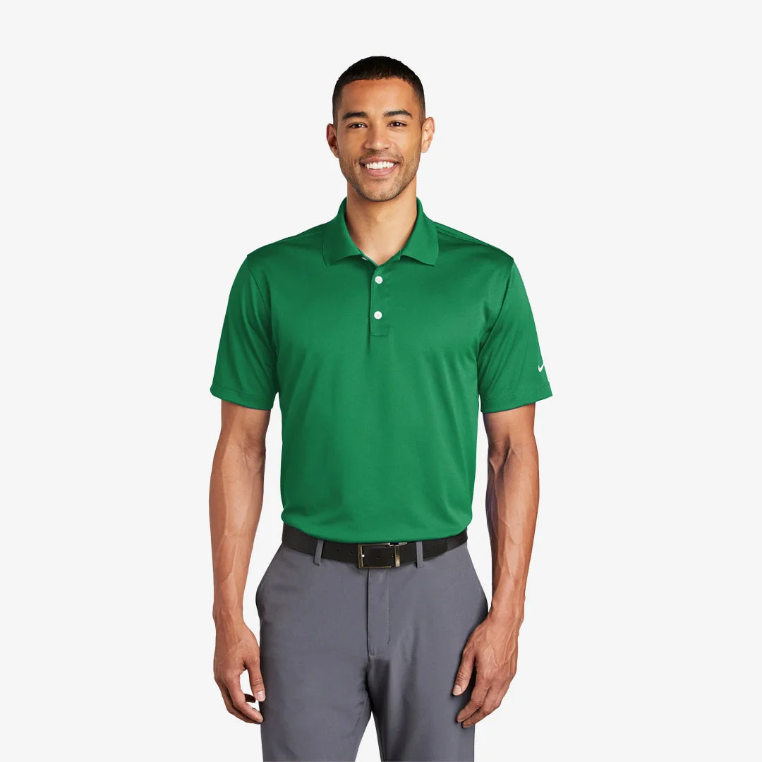 Man wearing Nike Tech Basic Dri-FIT Polo in Lucky Green - 203690
