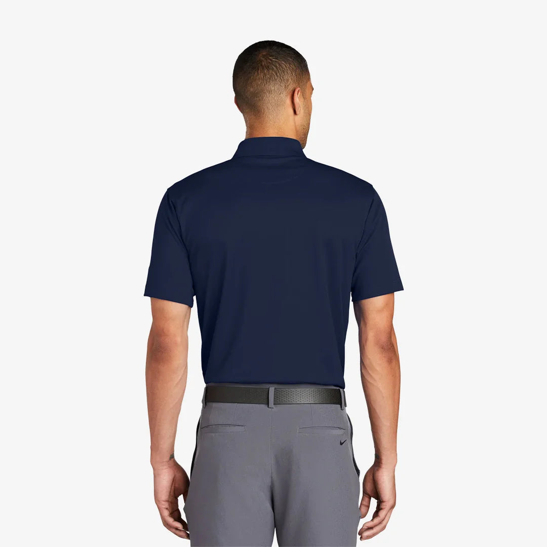 Man wearing Nike Tech Basic Dri-FIT Polo Back in Midnight Navy - 203690