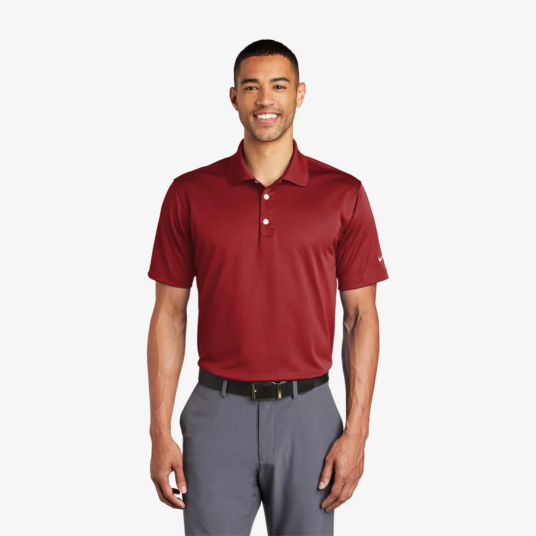 Man wearing Nike Tech Basic Dri-FIT Polo in Pro Red - 203690
