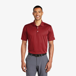 Man wearing Nike Tech Basic Dri-FIT Polo in Pro Red - 203690