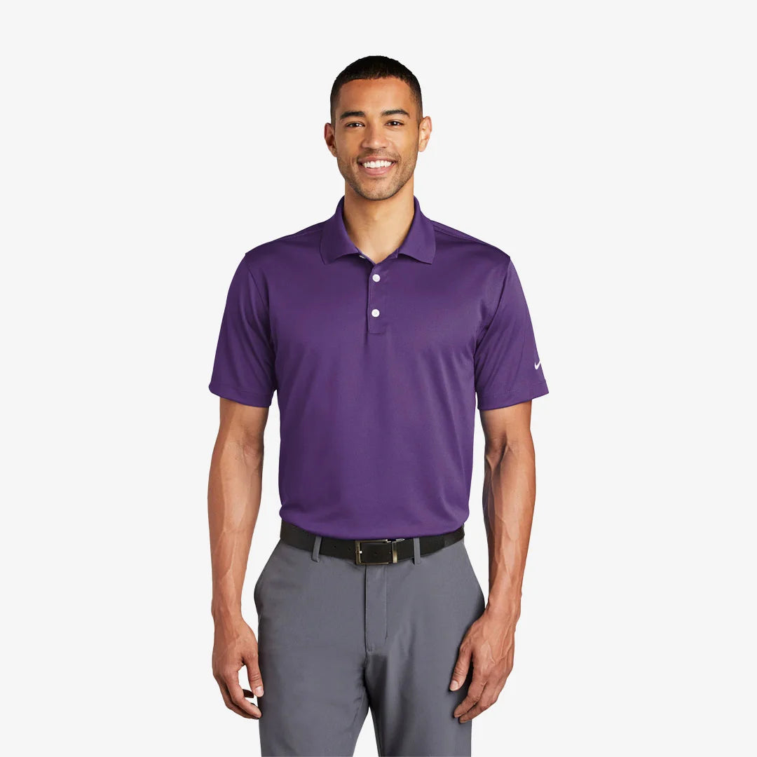 Man wearing Nike Tech Basic Dri-FIT Polo in Varsity Purple - 203690