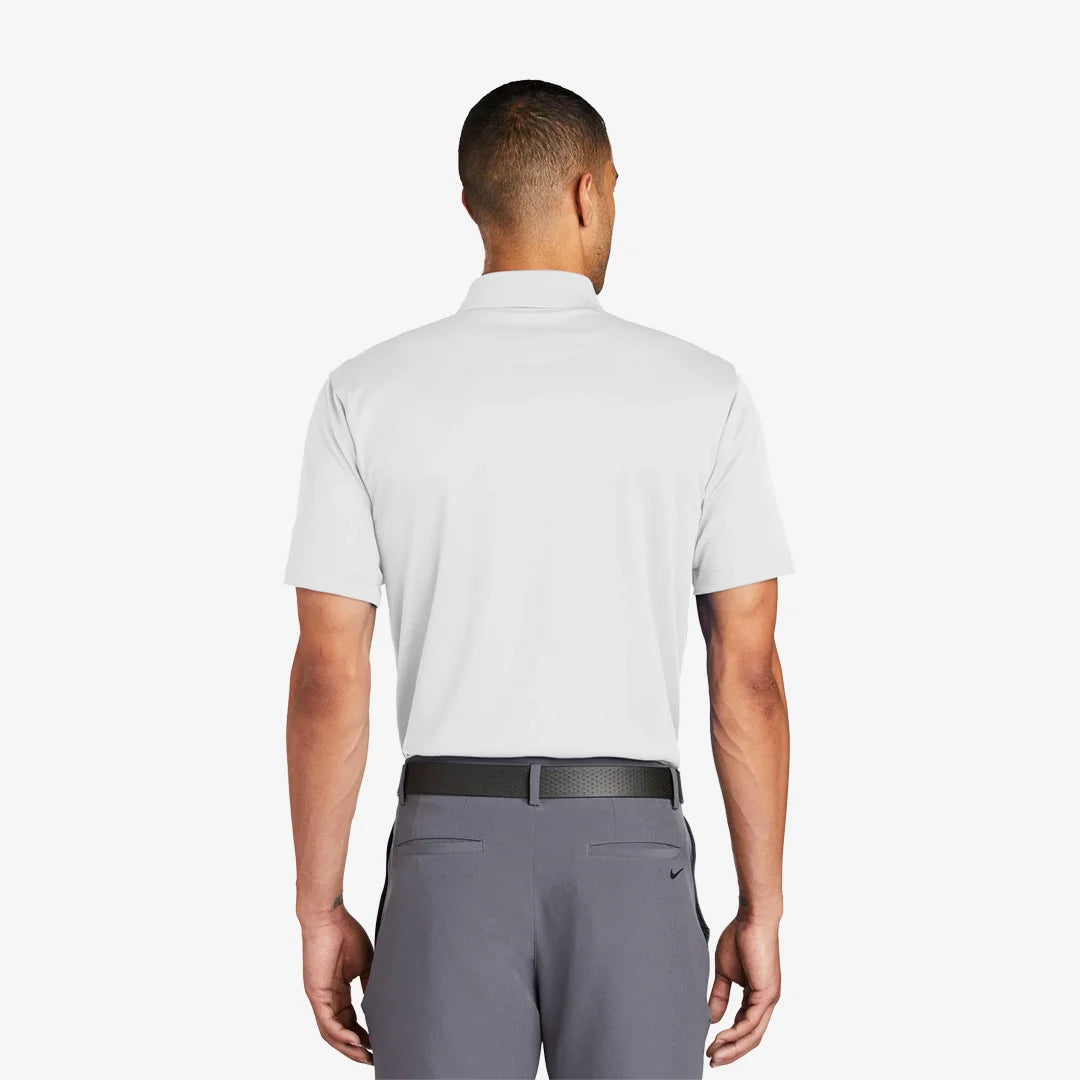 Man wearing Nike Tech Basic Dri-FIT Polo Back in White - 203690