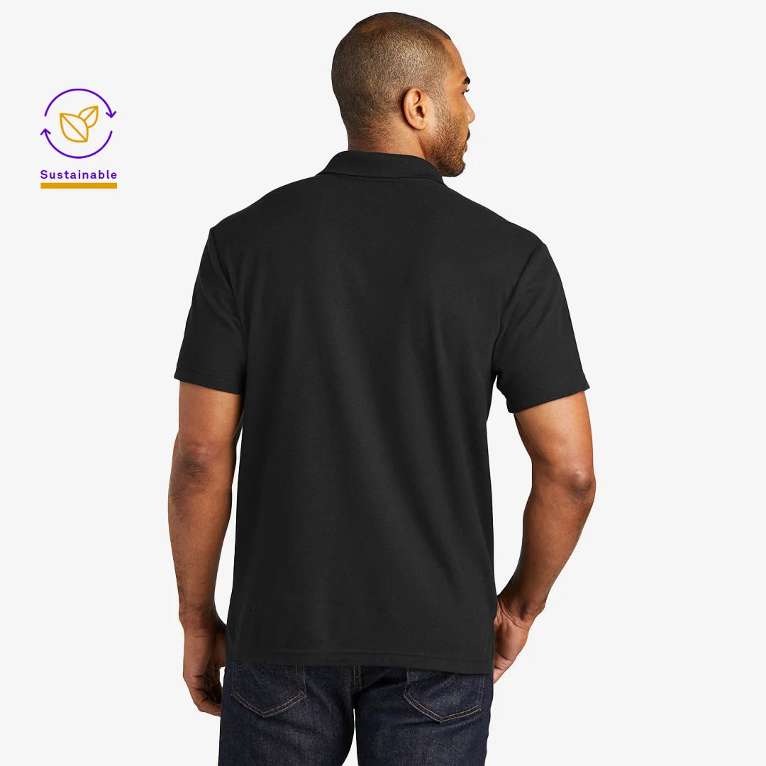 Man wearing Port Authority Men's C-FREE Cotton Blend Pique Polo Shirt in Black Back - K867