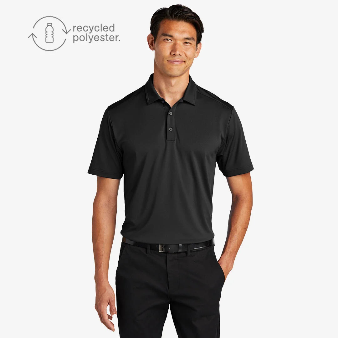 Man wearing Port Authority Men's C-FREE Snag-Proof Polo Shirt in Deep Black - K864