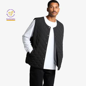 Man wearing AS Colour Quilted Vest in Black - 5531