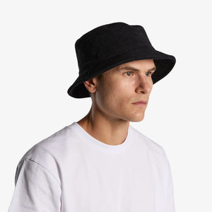 Man wearing AS Colour Terry Bucket Hat Side in Black - 1175