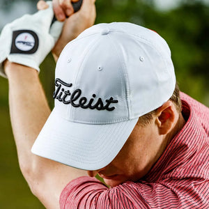 Golfer wearing Titleist Tour Performance Cap in White - 118398