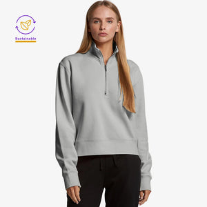 Woman wearing AS Colour Women’s Stencil Half Zip Fleece Pullover in Grey Marle Front Angle - 4125