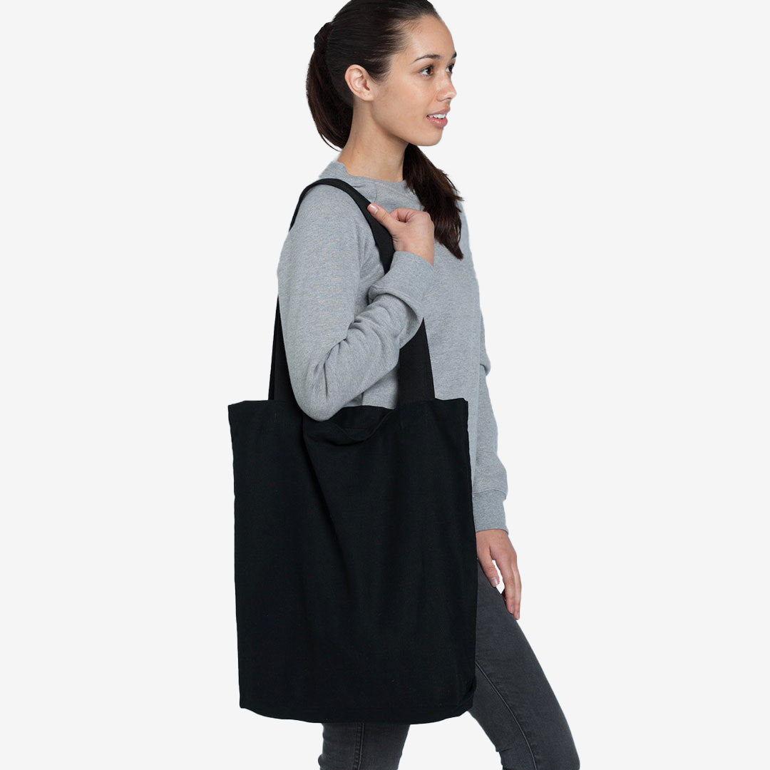 Woman wearing AS Colour Carrie Tote Bag in Black - 1001