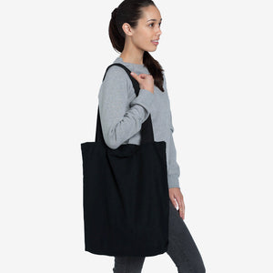 Woman wearing AS Colour Carrie Tote Bag in Black - 1001