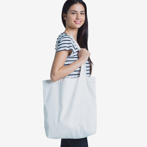 Woman wearing AS Colour Carrie Tote Bag in Cream - 1001