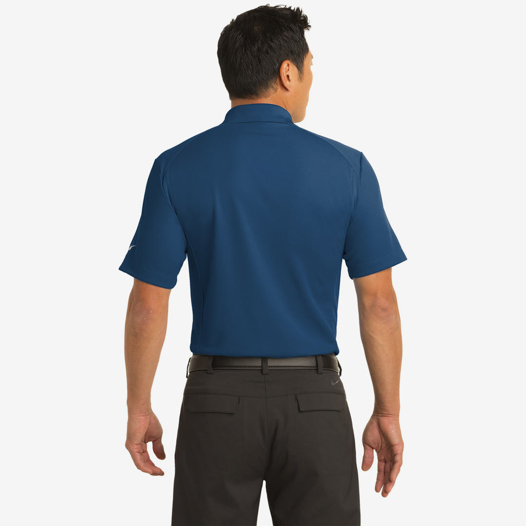 Man wearing Nike Men's Dri-FIT Classic Polo in Court Blue Back - 267020