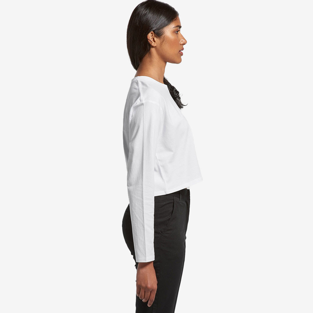 Woman wearing AS Colour Women's Crop Long Sleeve Tee in White Righthand Side - 4058