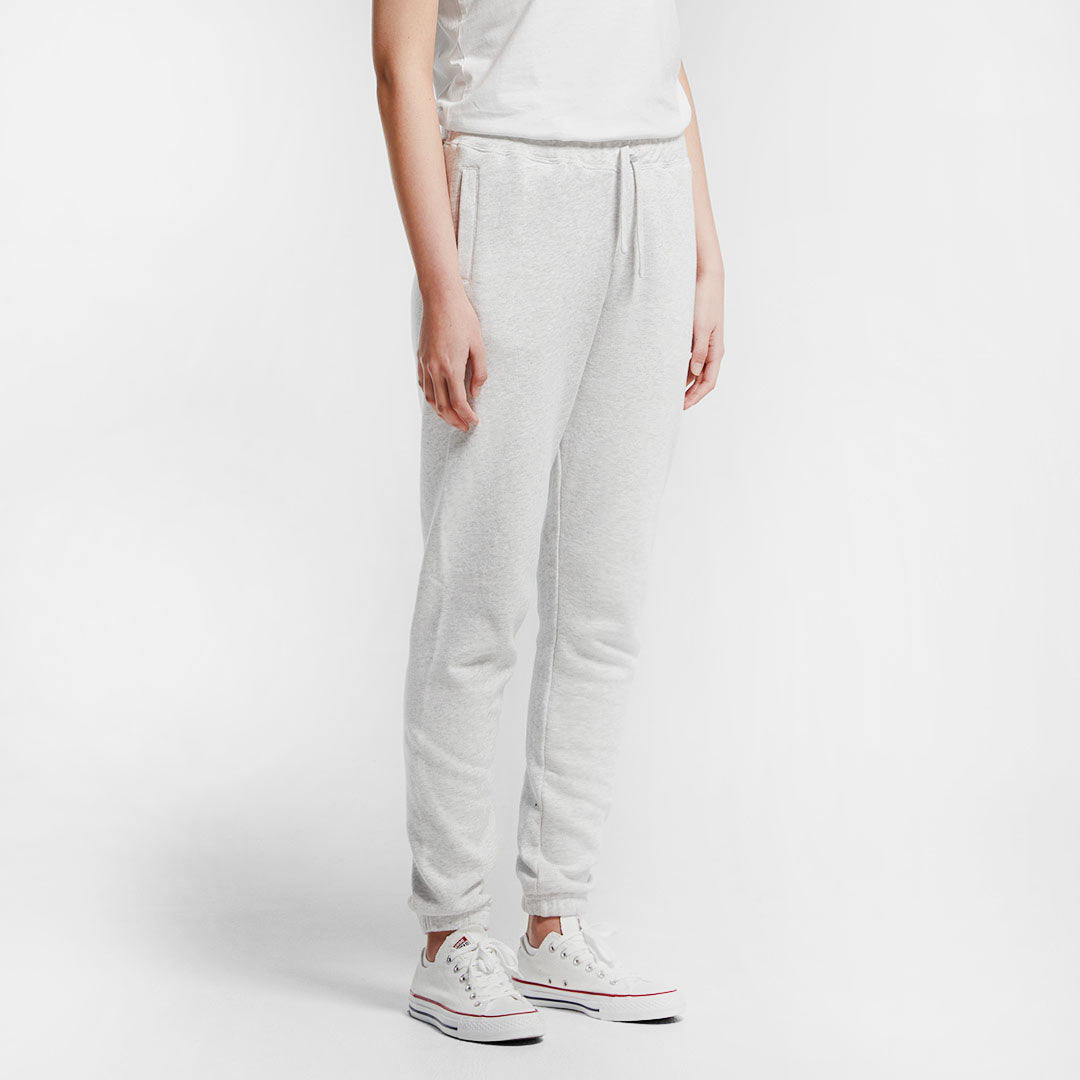 Woman wearing AS Colour Women's Surplus Track Pant in White Marle Right Side - 4067