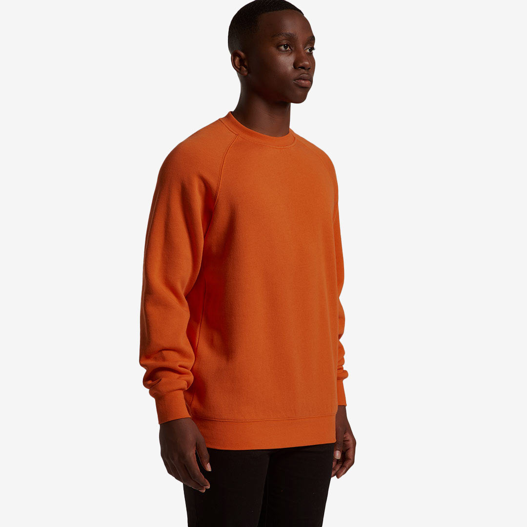 Man wearing AS Colour Men's Supply Crew Sweatshirt in Orange Right Side - 5100