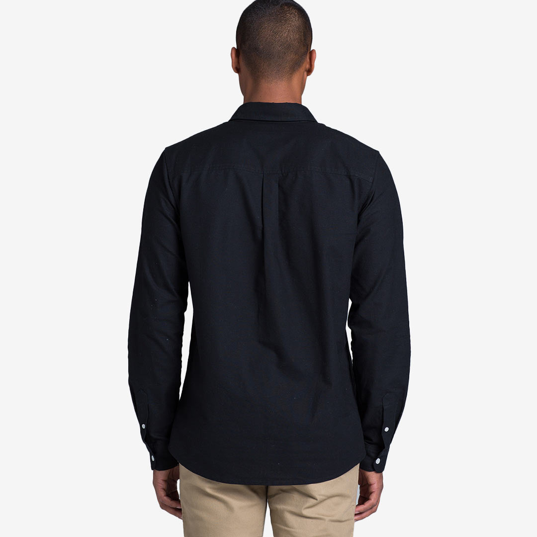 Man wearing AS Colour Men's Oxford Casual Long Sleeve Shirt in Navy Back - 5401