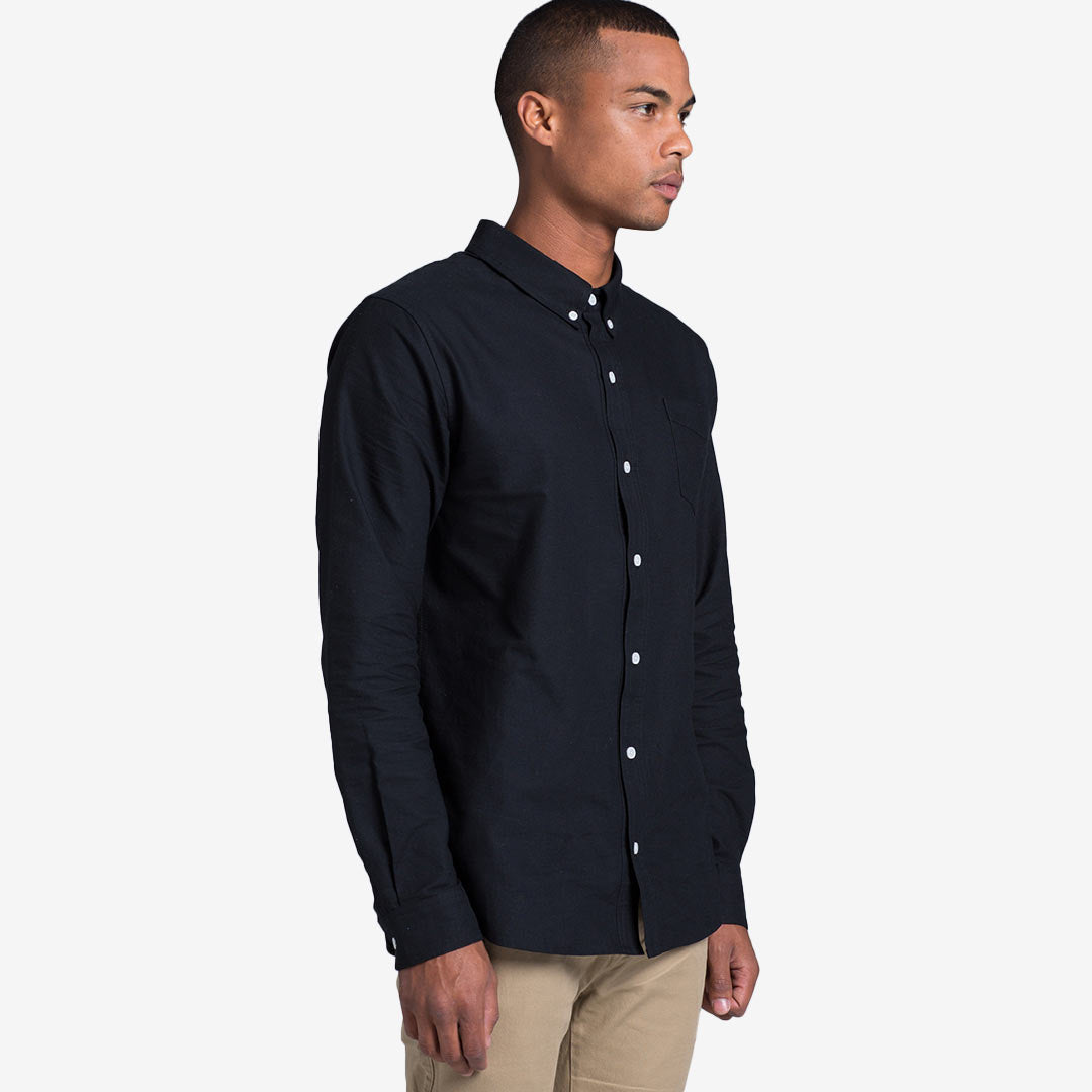 Man wearing AS Colour Men's Oxford Casual Long Sleeve Shirt in Navy Right Side - 5401