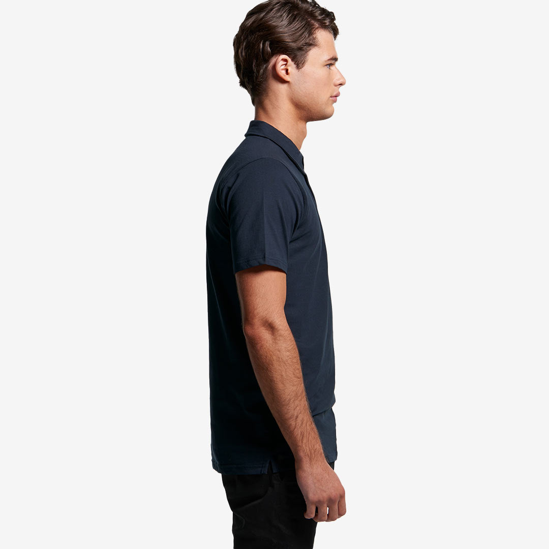 Man wearing AS Colour Men's Chad Polo in Navy Righthand Side - 5402