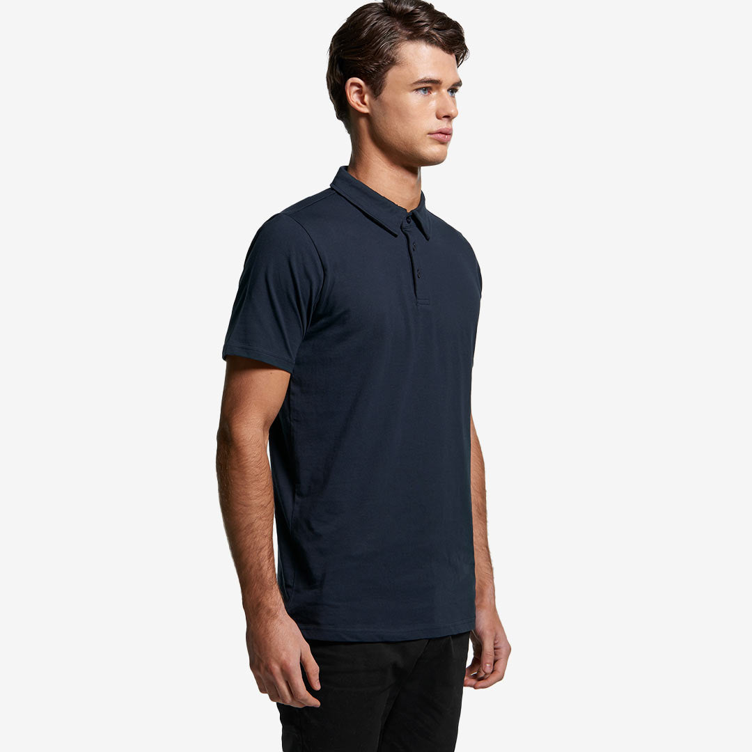Man wearing AS Colour Men's Chad Polo in Navy Right Side - 5402