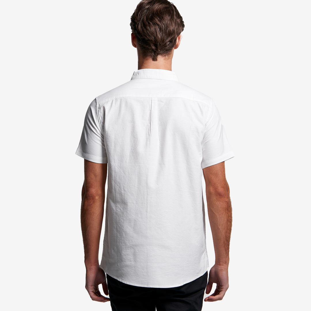 Man wearing AS Colour Men's Oxford Short Sleeve Shirt in White Back - 5407