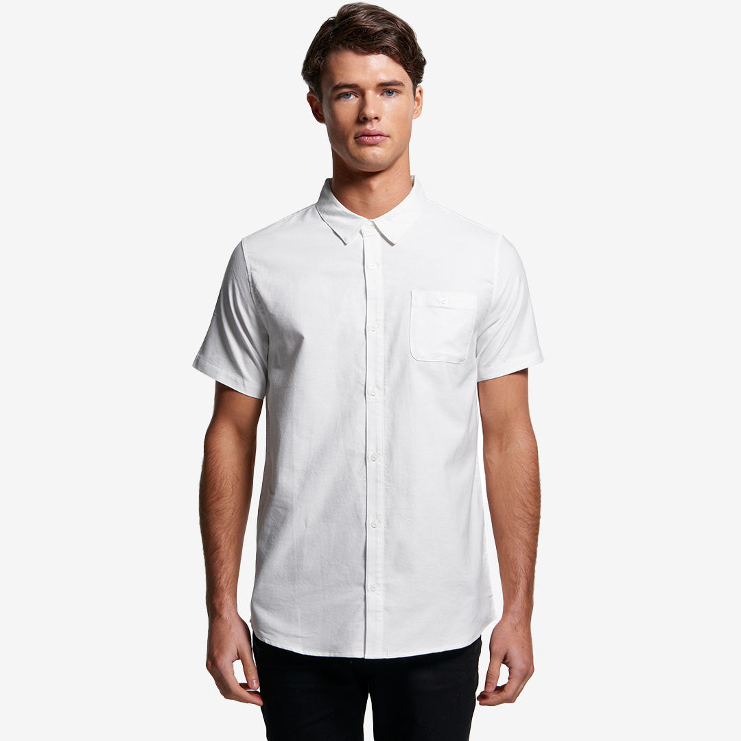 Man wearing AS Colour Men's Oxford Short Sleeve Shirt in White Front - 5407