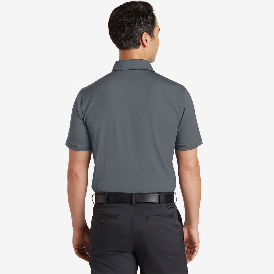 Man wearing Nike Men's Dri-FIT Solid Icon Pique Modern Fit Polo in Dark Grey Back - 746099