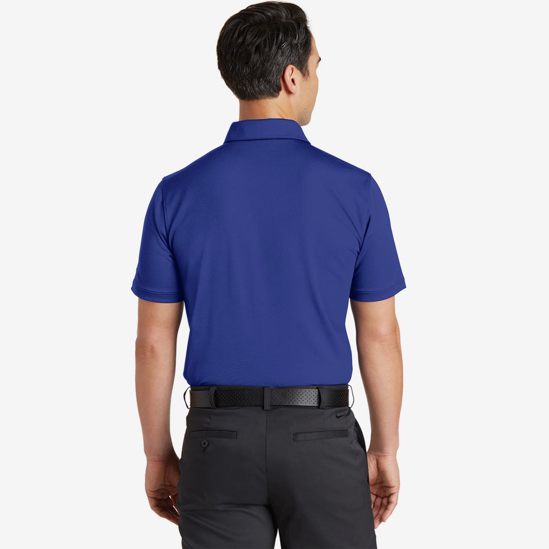 Man wearing Nike Men's Dri-FIT Solid Icon Pique Modern Fit Polo in Deep Royal Blue Back - 746099