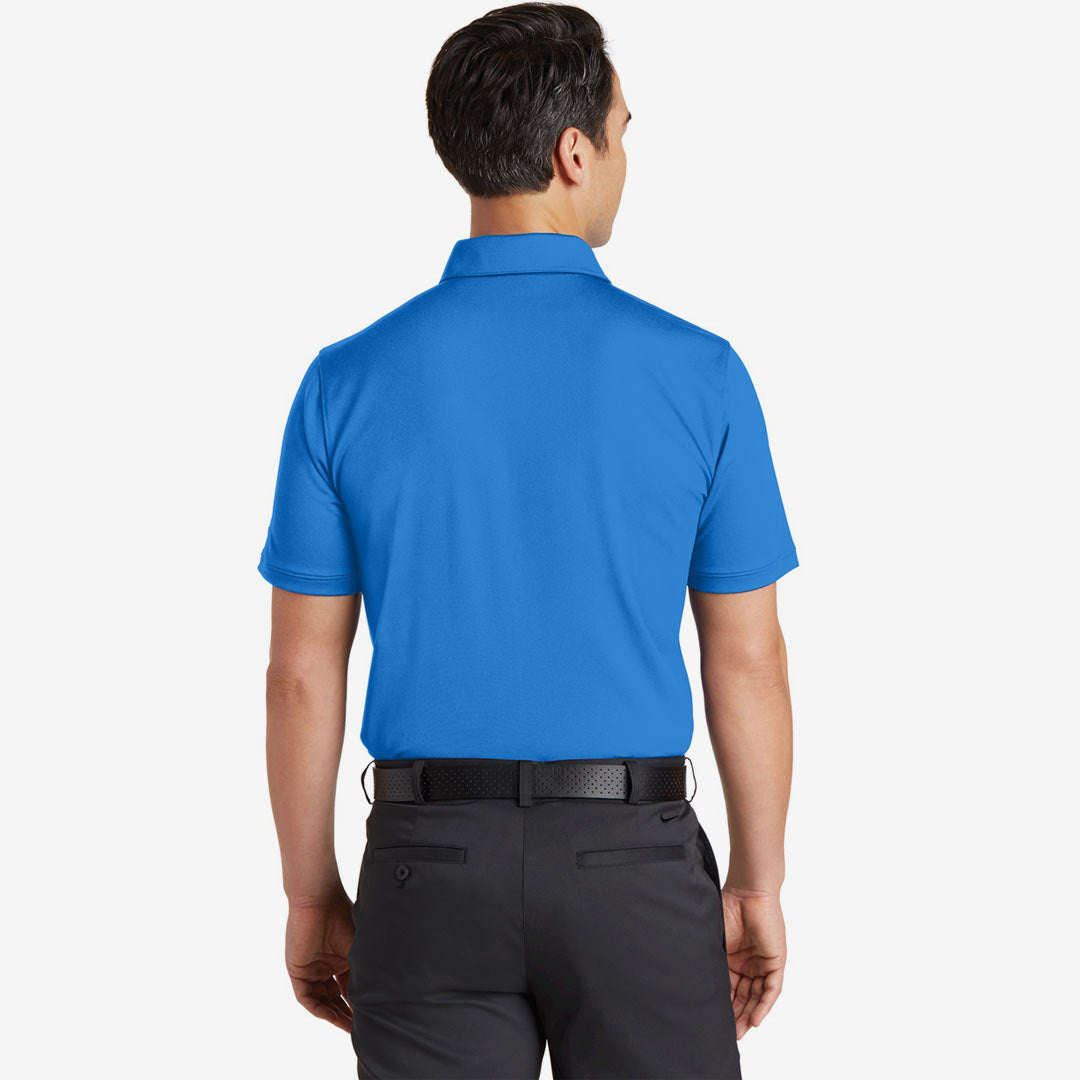 Man wearing Nike Men's Dri-FIT Solid Icon Pique Modern Fit Polo in Light Photo Blue Back - 746099