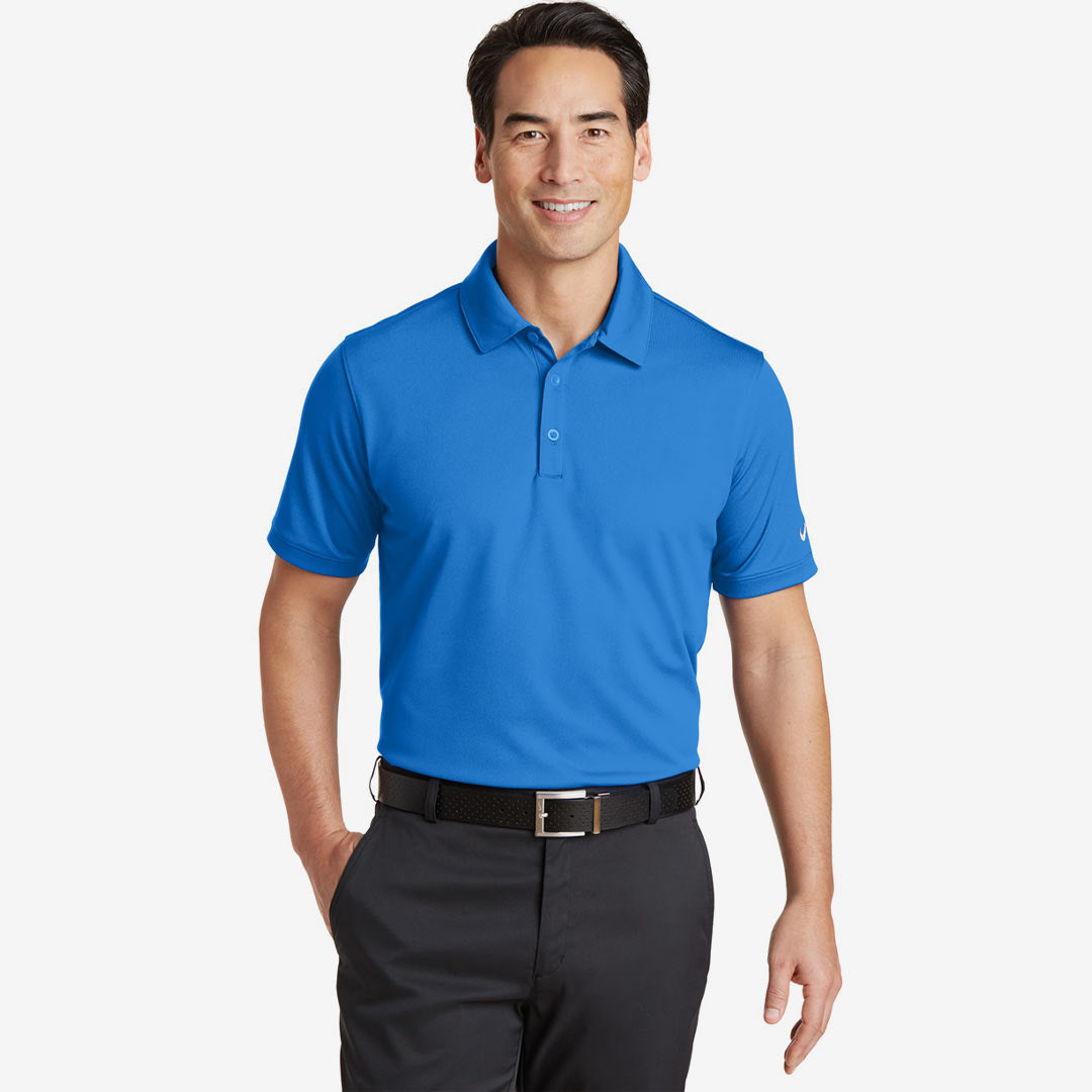 Man wearing Nike Men's Dri-FIT Solid Icon Pique Modern Fit Polo in Light Photo Blue Front - 746099