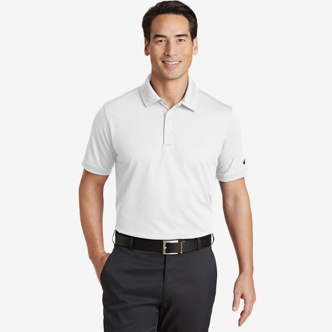 Man wearing Nike Men's Dri-FIT Solid Icon Pique Modern Fit Polo in White Front - 746099