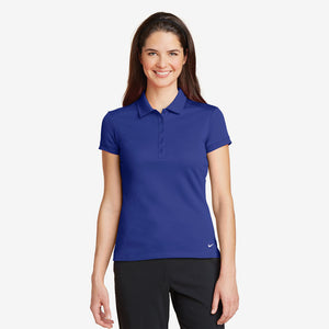 Woman wearing Nike Ladies Dri-FIT Solid Icon Pique Modern Fit Polo in Deep Royal Blue Front - 746100