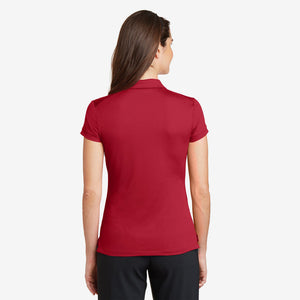 Woman wearing Nike Ladies Dri-FIT Solid Icon Pique Modern Fit Polo in Gym Red Back - 746100